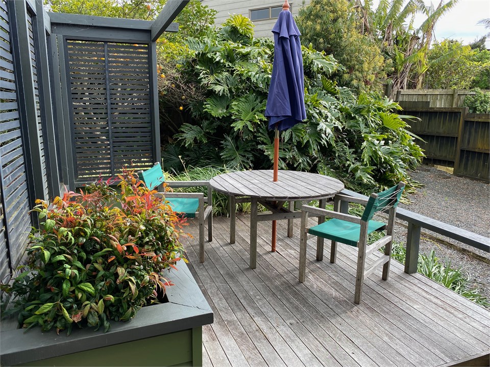 Sunny outdoor deck with BBQ