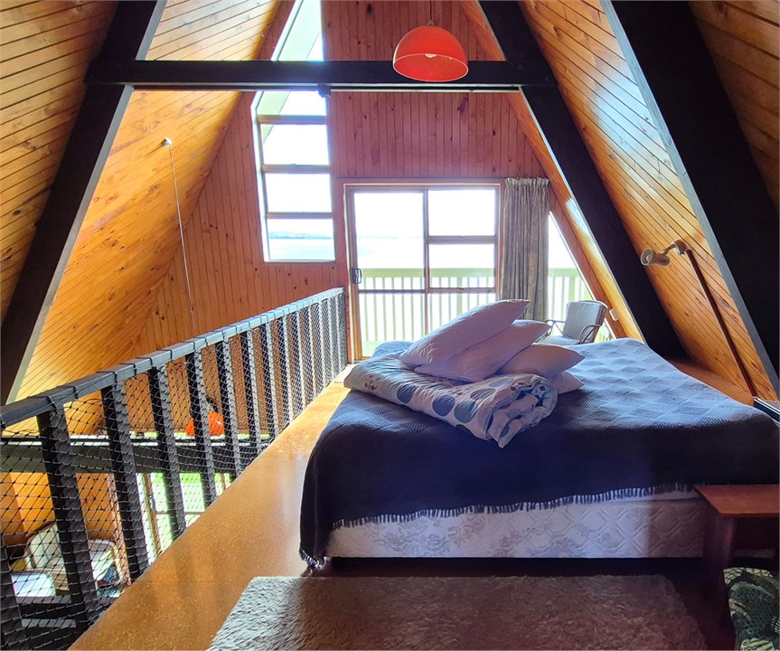 Main bedroom with balcony, beach facing