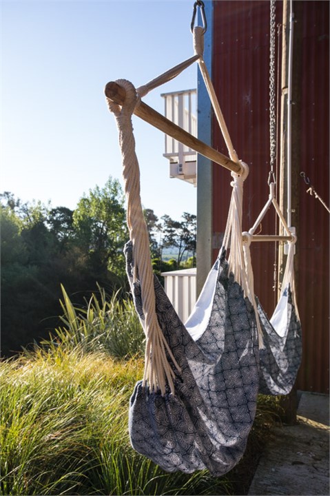 Relax in the hammocks in the 'hay barn'