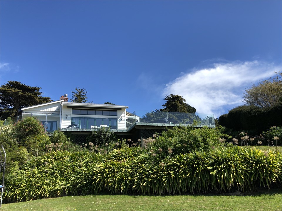 Large rustic farmhouse with sprawling gardens nest