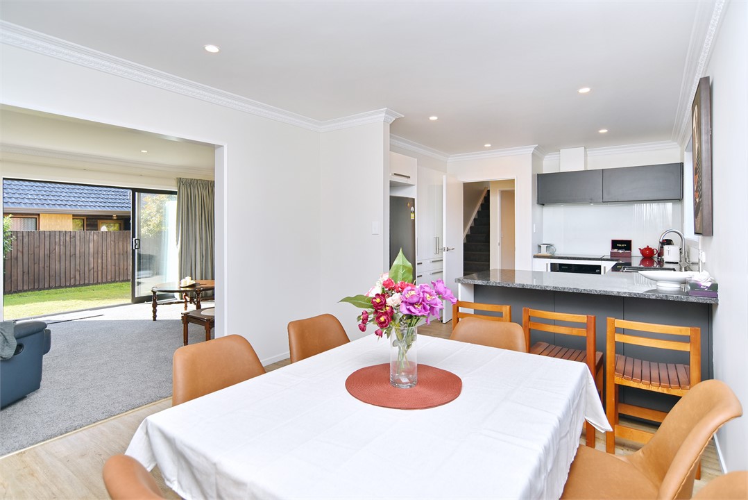 Dining area with the kitchen in the background