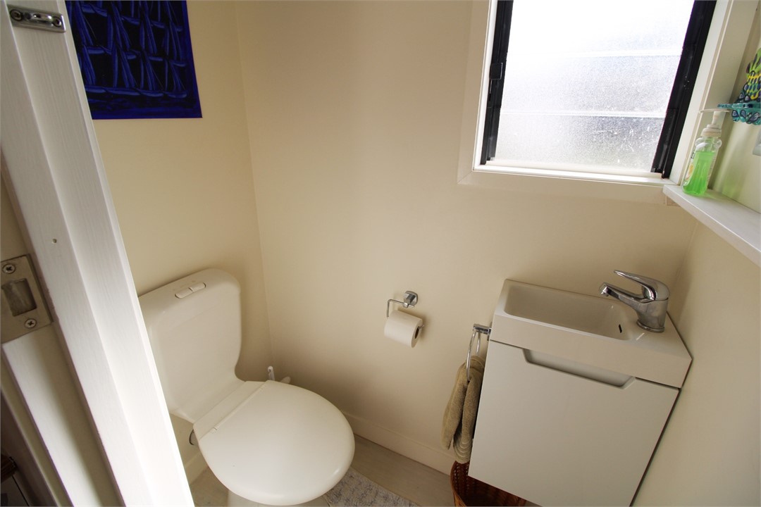 Small toilet room of Galley Kitchen