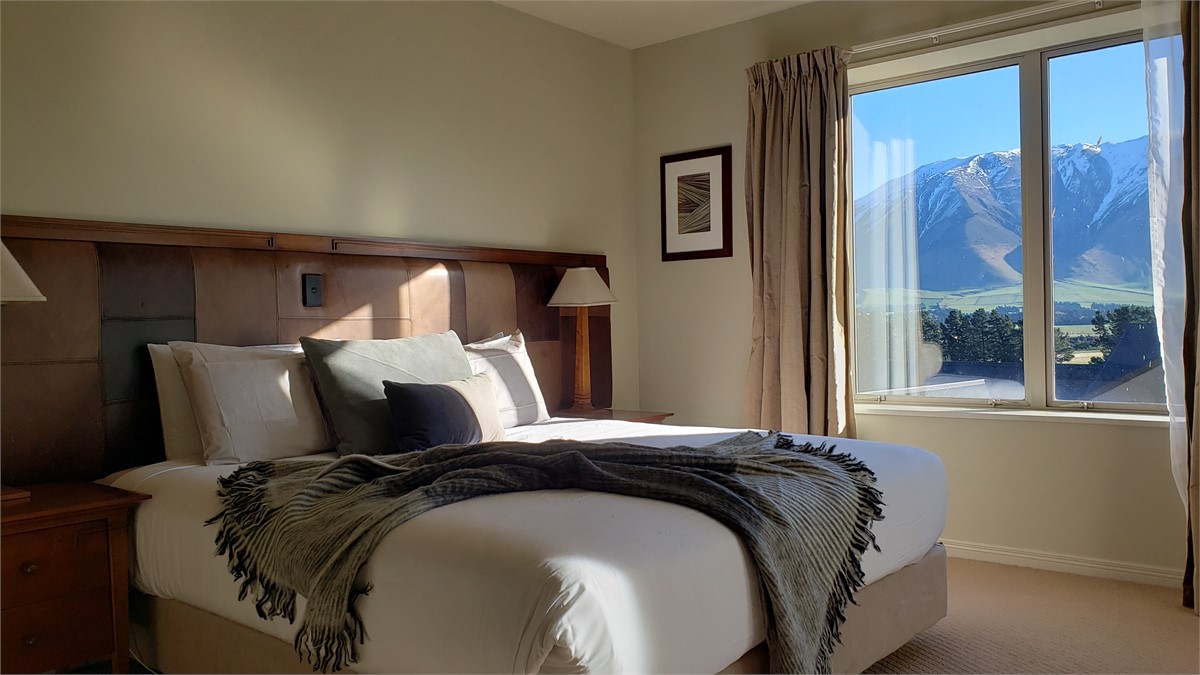 Main bedroom overlooking snowy mountains
