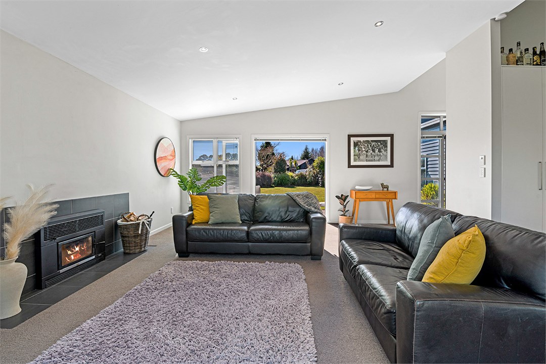 Open plan lounge with wood burner