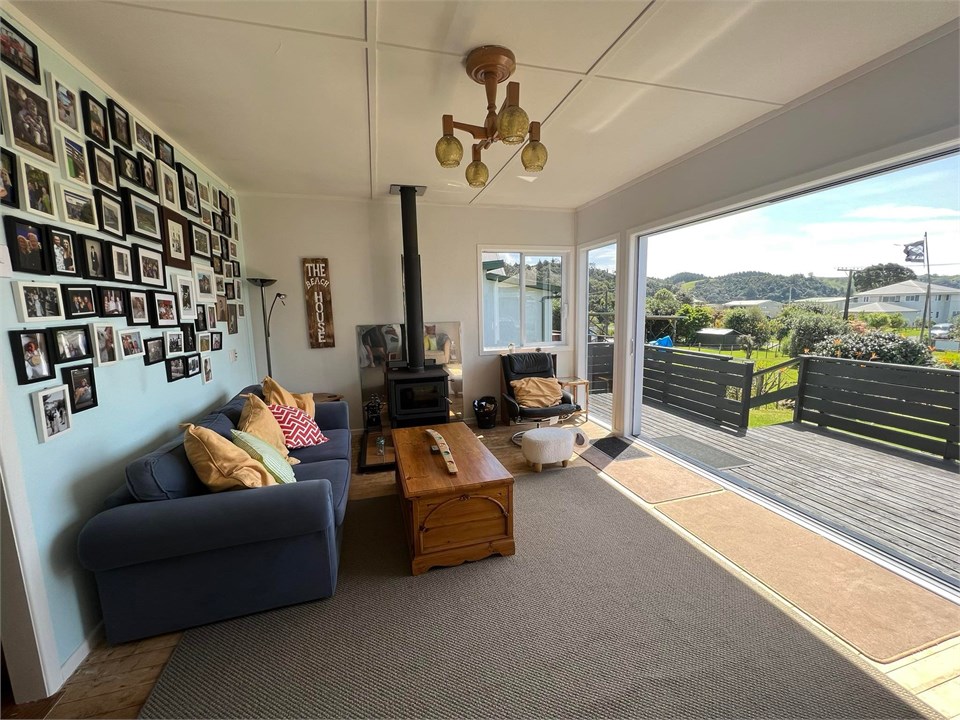 Living Room with double open doors access to deck