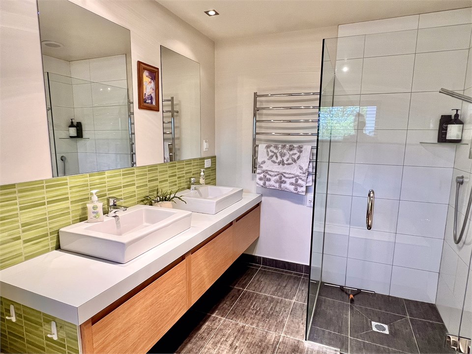 Bathroom 1 has a shower, bath and toilet