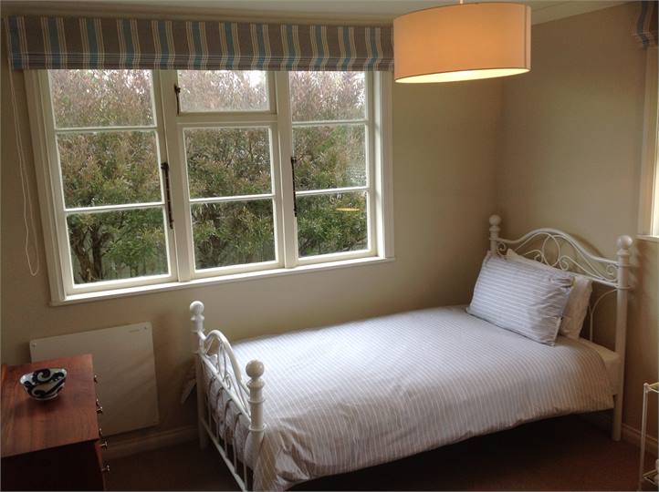 Bedroom 3: Two King Single Beds.