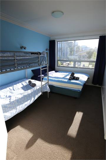 Room 2 with a queen bed & double bunk bed 