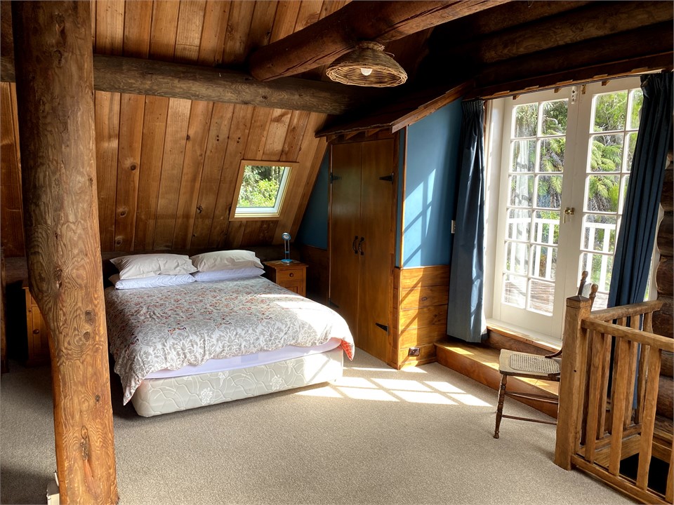 Main bedroom upstairs in log cabin
