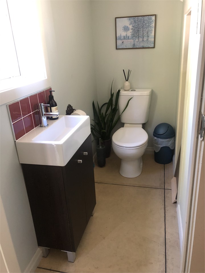 Toilet under stairs - off laundry
