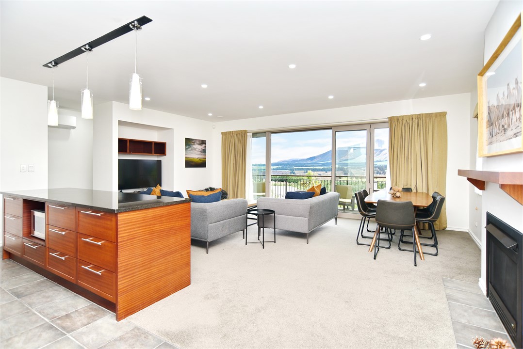 Living area with a TV and a Balcony with a view