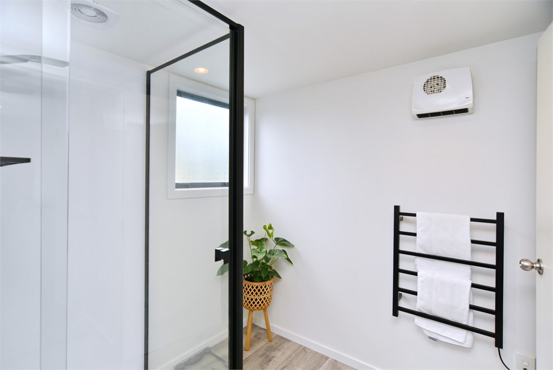 Bathroom has a shower and a toilet