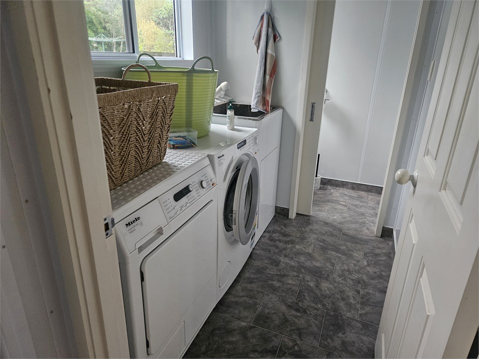 Laundry with Second Toilet beyond
