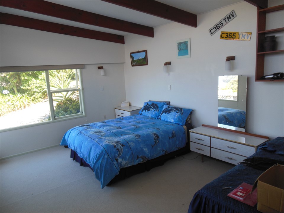 Large Queen back bedroom with extra single bed