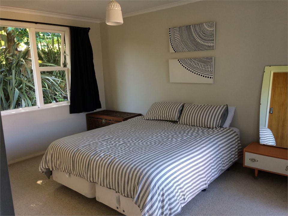 Main Bedroom with King size bed + french doors ont
