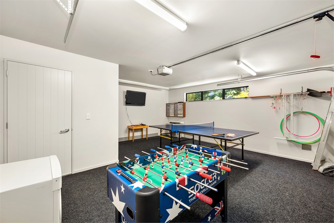 Garage set up as games-room. Table tennis, foosbal
