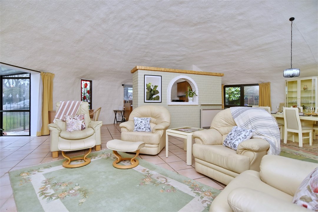 Living room with seating areas and a TV