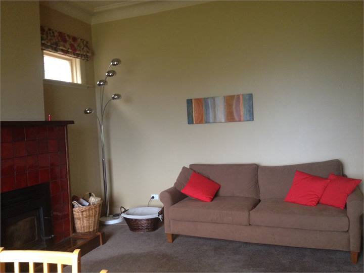 Log burner in Lounge.