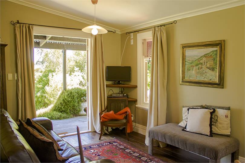 The living room opens onto the deck, with a view.