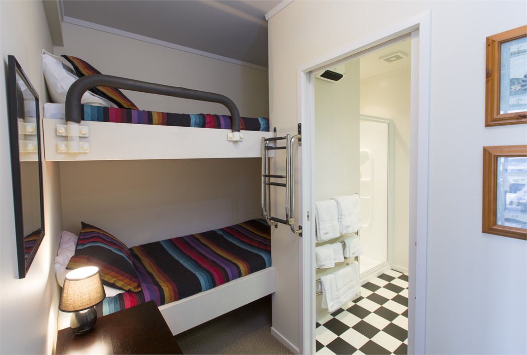 Bunk alcove next to bathroom.