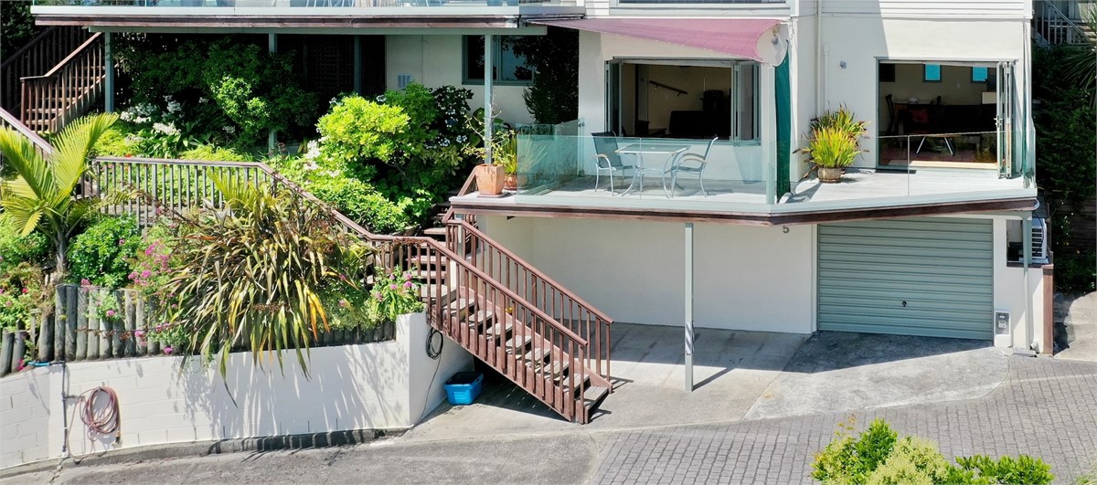 Apartment 1 occupies the lower level