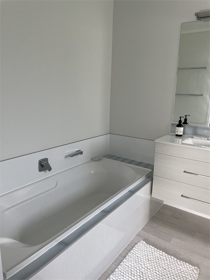 Downstairs. Ensuite bathroom off bedroom 3.