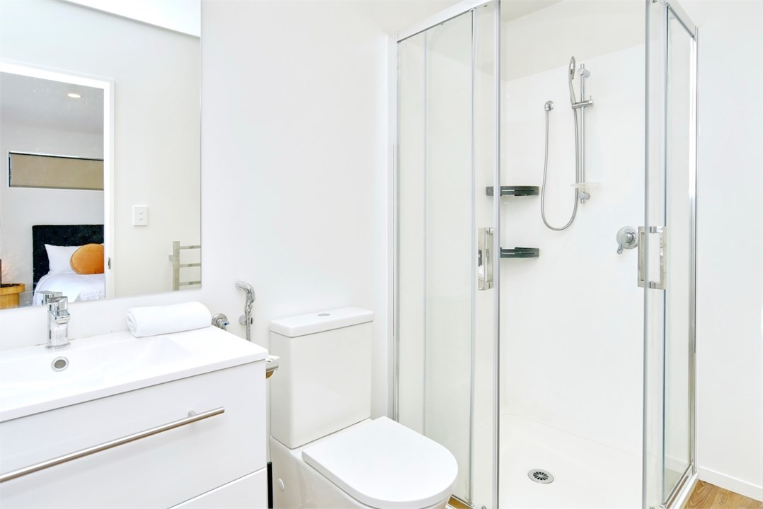 Bathroom 2 has a shower and a toilet