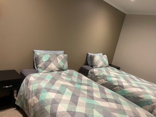 Bedroom with 2 king single beds