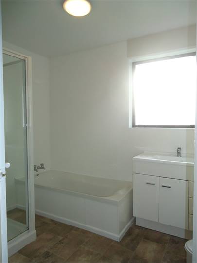 The bathroom: functional & clean. Separate shower.