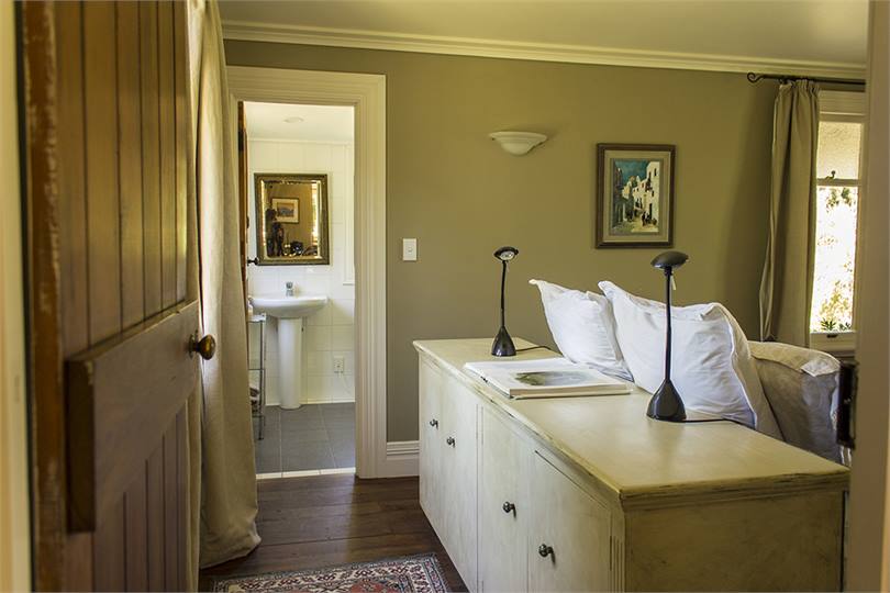 The bedroom, looking through to the bathroom.