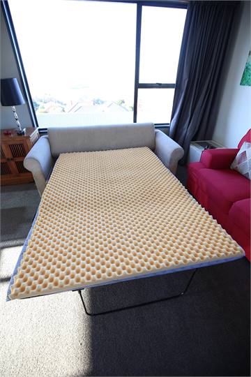 Double sofa bed in lounge