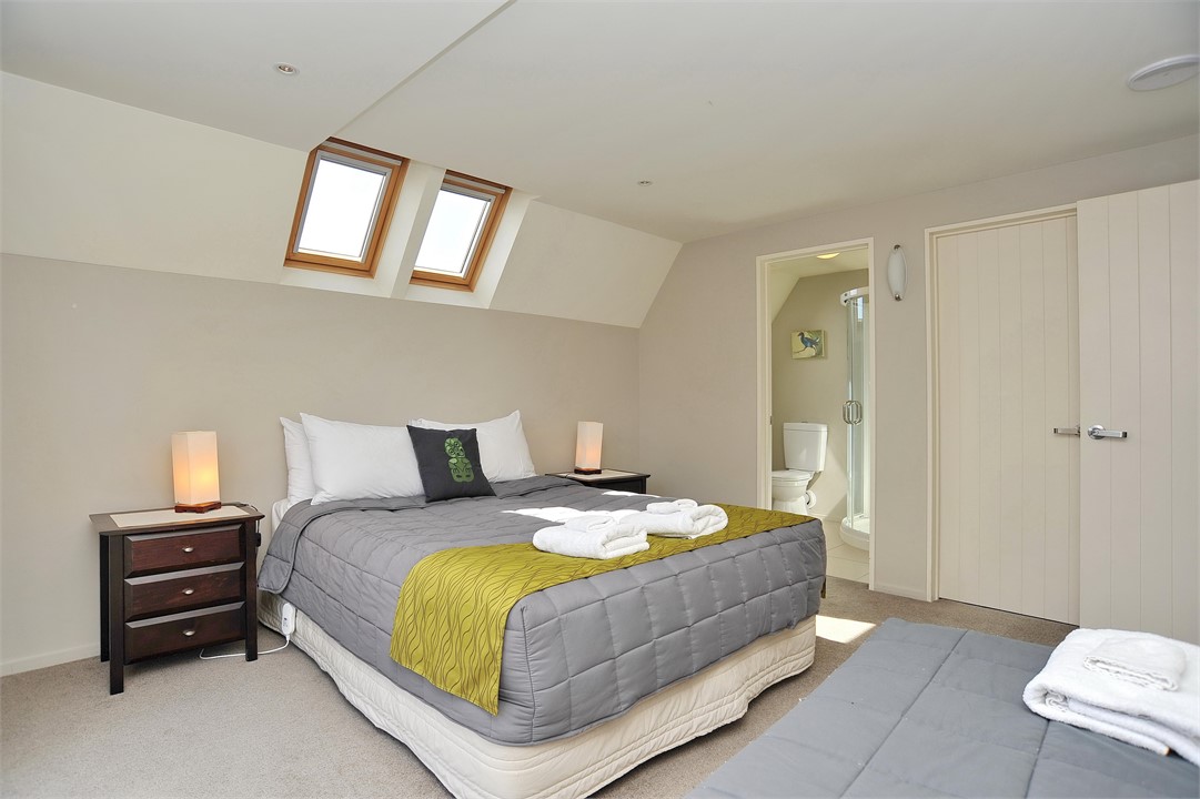 Bedroom 1 has a Queen and Single bed with ensuite