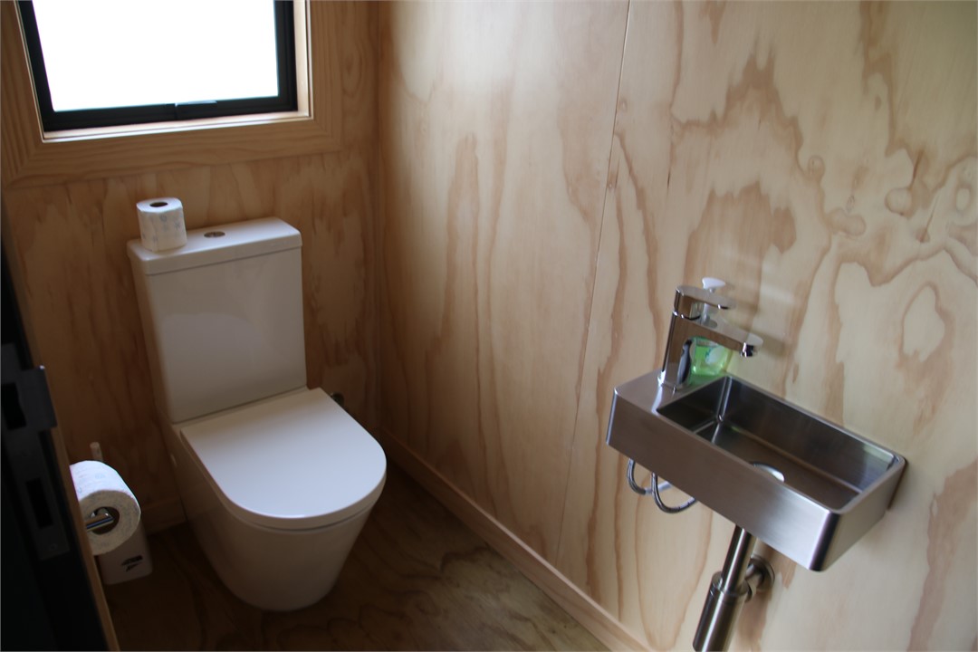 Toilet off rear porch