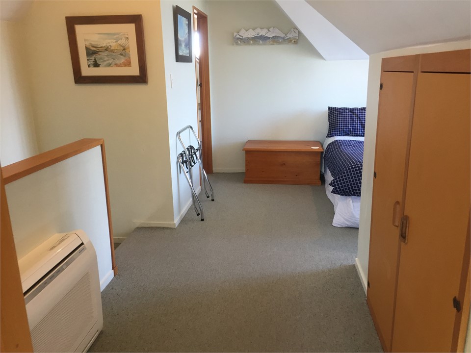 Open plan bedroom leads to bathroom