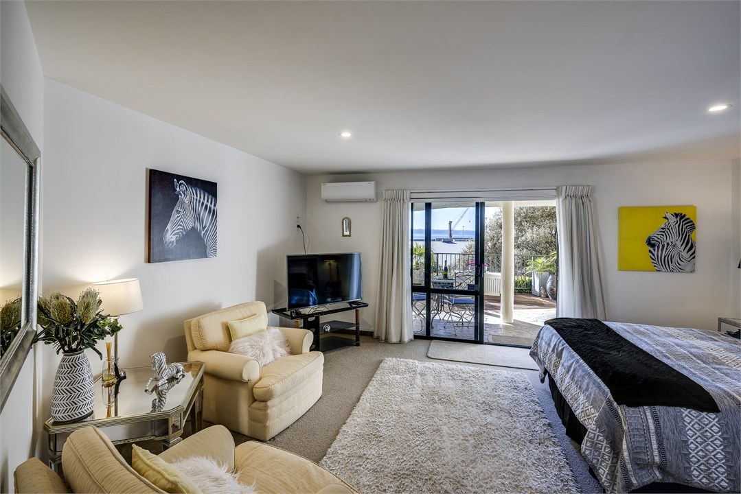 Main bedroom opening onto decks