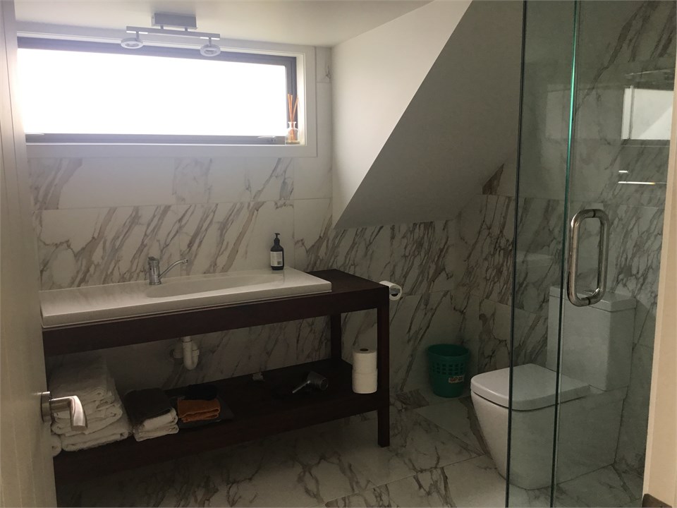 Vanity room with shower and toilet