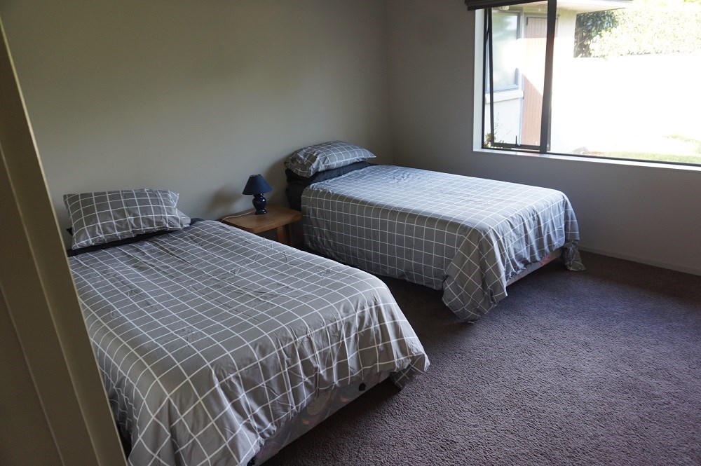 Bedroom with 2 king single beds