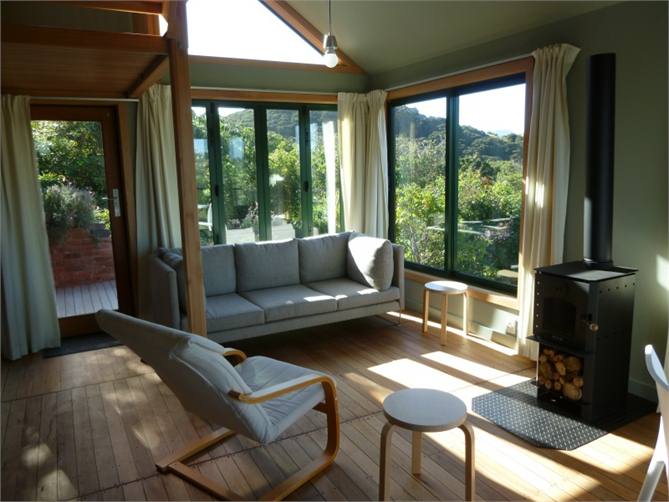 Living area with eco fireplace and views to garden