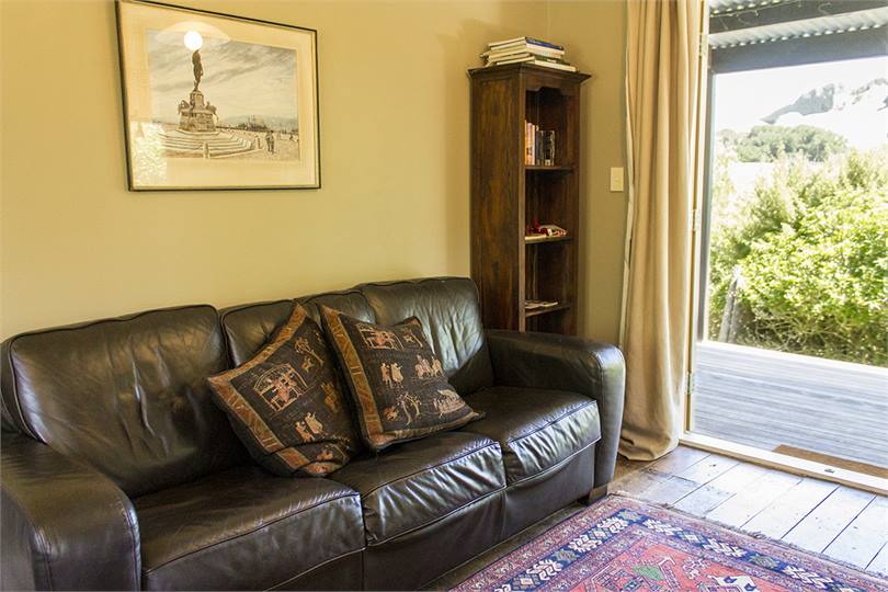 Comfortable, modern furniture and a small library.