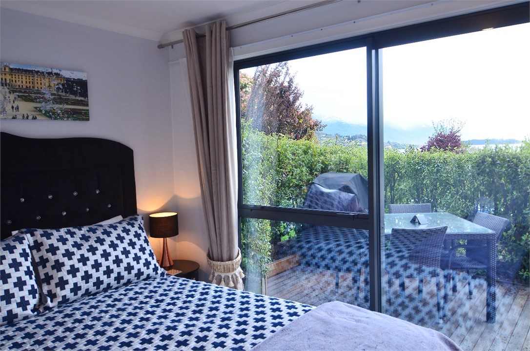 Master bedroom opens onto BBQ patio deck