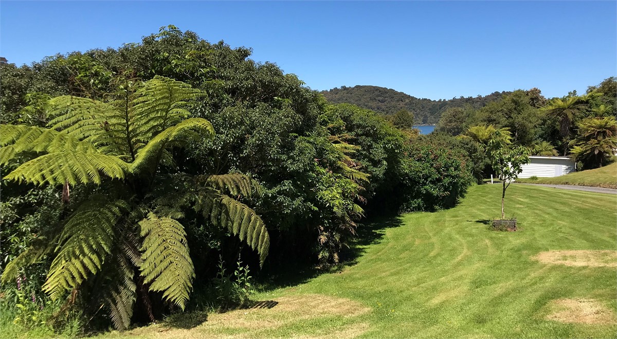 Front drive, beach just at corner of road.