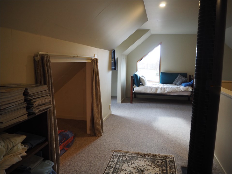 Upstairs open bedroom - with three single beds eac