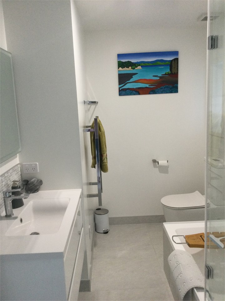 Main bathroom with shower over the bath