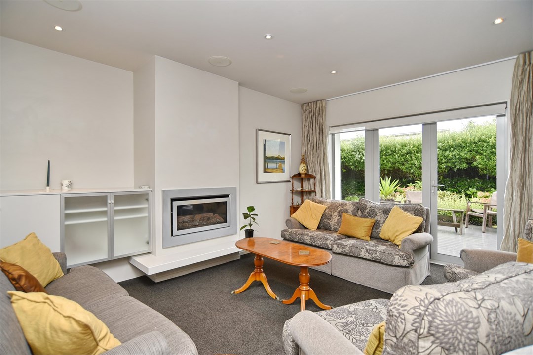 Living room with seating areas and a fireplace
