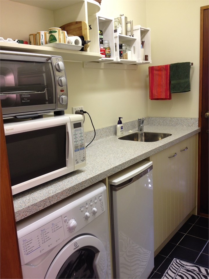 The separate Kitchenette/Laundry area.