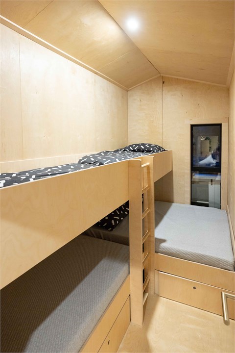 Second bedroom has a queen bed and three custom bu