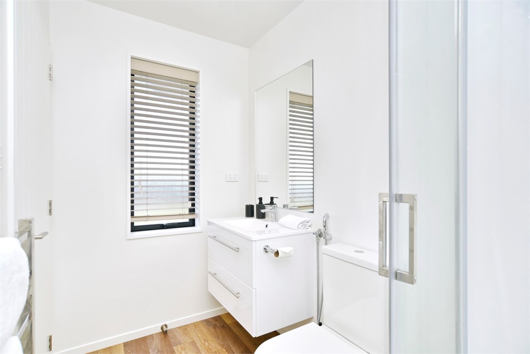 Bathroom 2 has a shower and a toilet