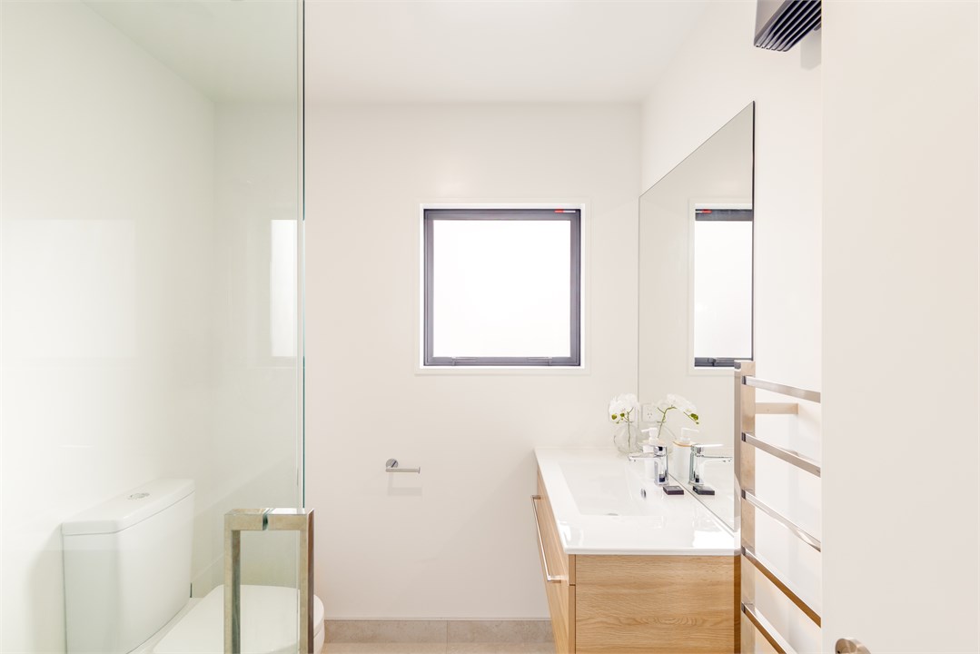 Bathroom 2 has a shower and a toilet