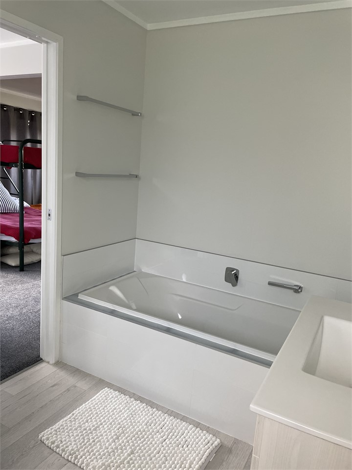 Downstairs. Ensuite bathroom off bedroom 3.