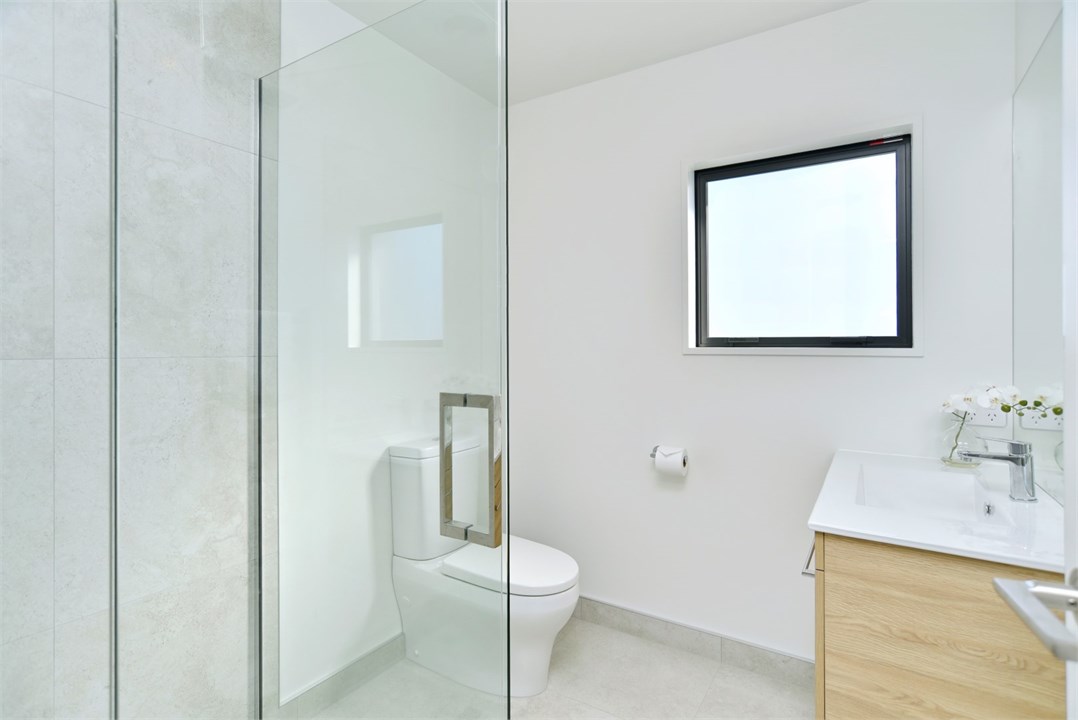 Bathroom 2 has a shower and a toilet